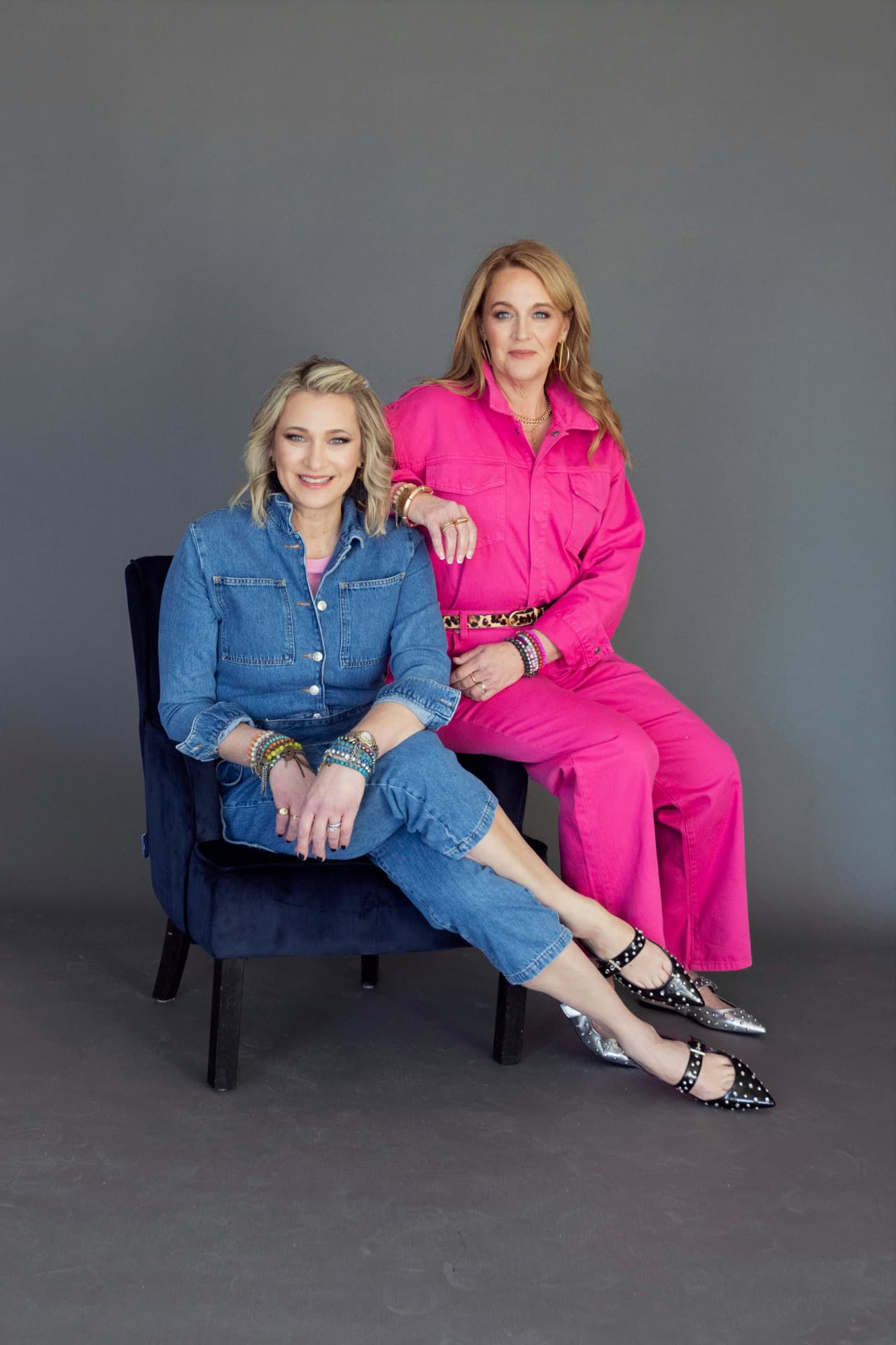 Kristen Campbell and Kristin Argento in denim and bright pink for their book launch